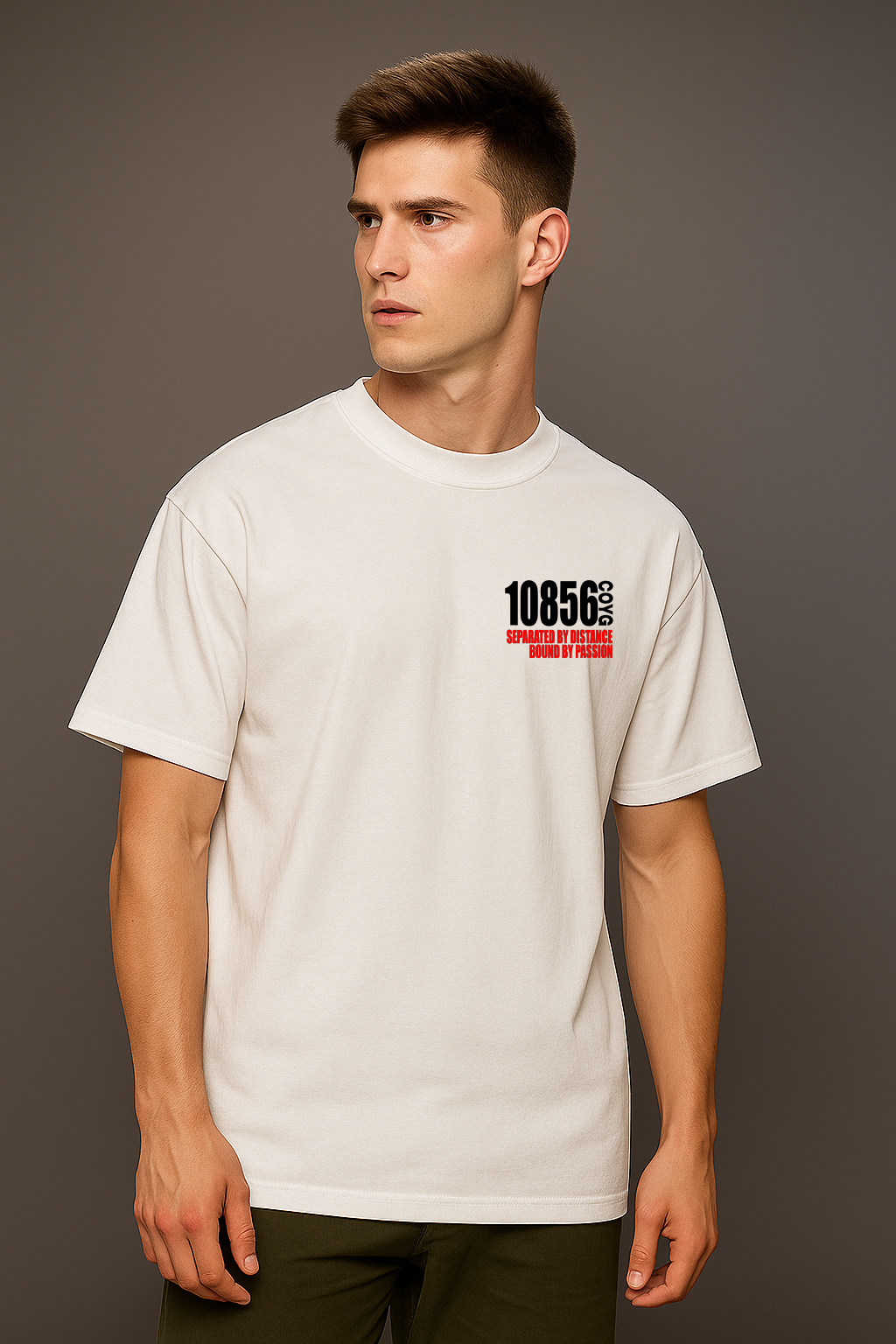 Man wearing a white t-shirt with a 10856 and black logo on a gray background

