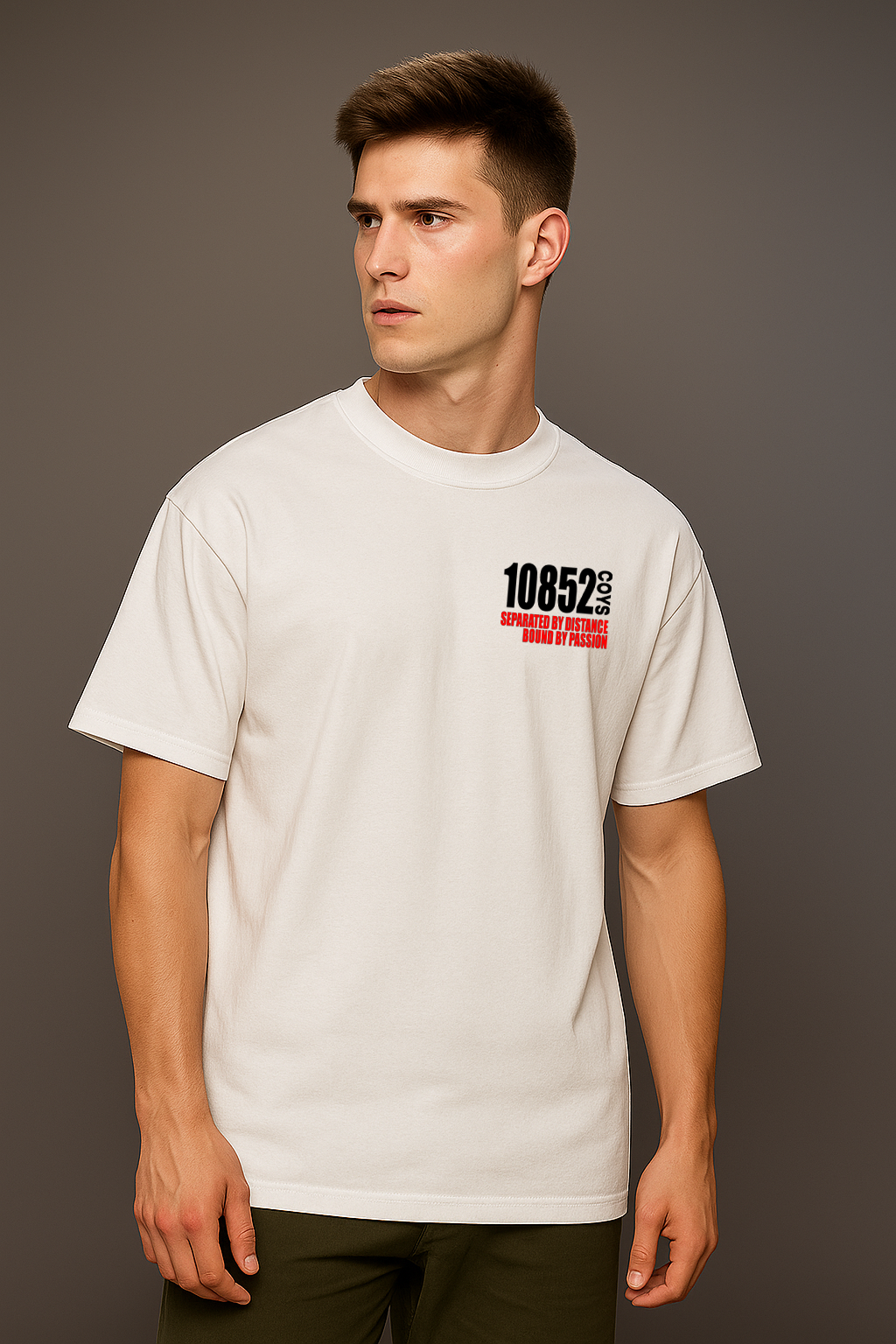 Man wearing a white t-shirt with 10852 black text on a gray background