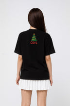 A lady wearing a black Trust-the-Process with COYG T-Shirt at the back made by Unique for Fans