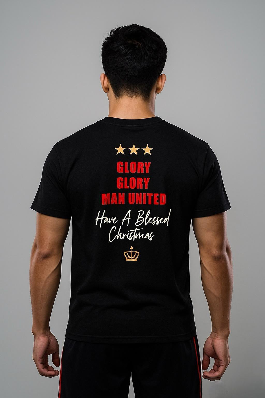 A man wearing a black King Santona T-shirt with Glory Glory at the back made by Unique for Fans