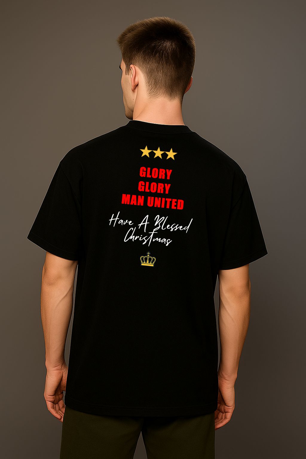 A man wearing a black King Santona T-shirt with Glory Glory at the back made by Unique for Fans